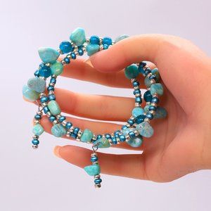 Memory wire Turquoise bracelet with seed beads and hanging accents.